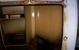 Exhaust fan housing and centrifugal wheel caked with grease before cleaning