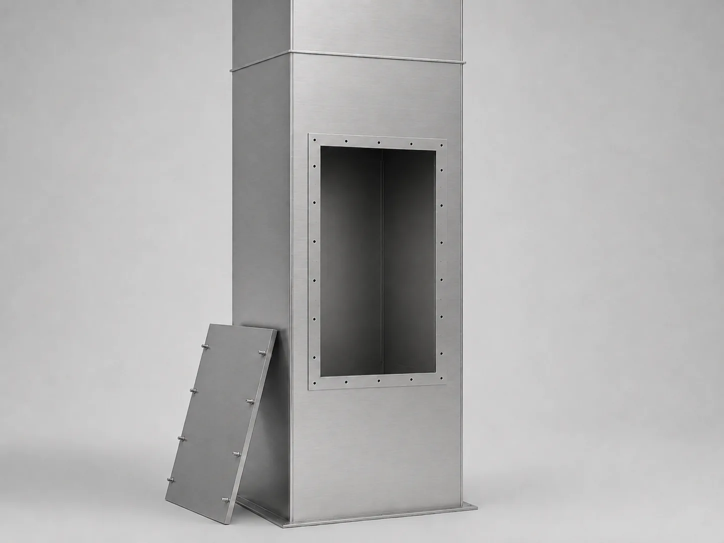 Vertical kitchen exhaust duct with its access panel removed, showing the empty interior