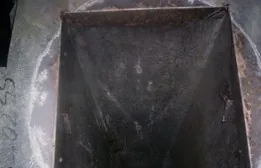 The same vertical duct opening scraped and cleaned after service